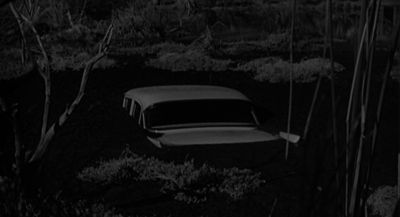 Still from Psycho (1960) that has been tagged with: exterior & medium wide & car