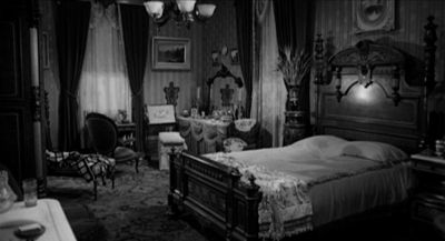 Still from Psycho (1960) that has been tagged with: black and white & bed & wide shot & interior