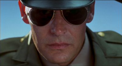 Still from Psycho (1998) that has been tagged with: 000000 & sunglasses & hat & close-up