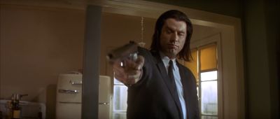 Still from Pulp Fiction (1994) that has been tagged with: 714f38 & medium shot & low-angle & gun