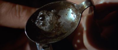 Still from Pulp Fiction (1994) that has been tagged with: extreme close-up & spoon & heroin