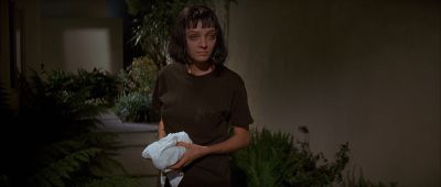 Still from Pulp Fiction (1994) that has been tagged with: 000000 & clean single & exterior & medium wide