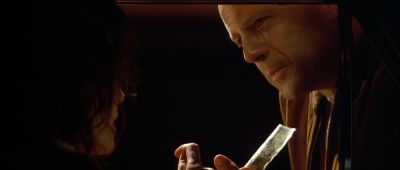 Still from Pulp Fiction (1994) that has been tagged with: over-the-shoulder & taxi & money & close-up & interior