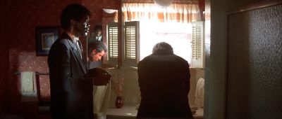 Still from Pulp Fiction (1994) that has been tagged with: f4a662 & over-the-shoulder & day