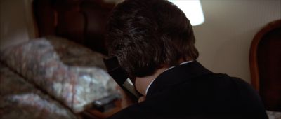 Still from Pulp Fiction (1994) that has been tagged with: bed & phone & medium close-up & over-the-shoulder