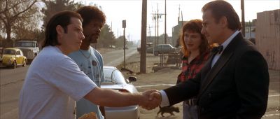 Still from Pulp Fiction (1994) that has been tagged with: a67a59 & exterior & handshake & medium wide