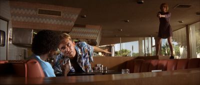Still from Pulp Fiction (1994) that has been tagged with: restaurant & gun & robbery & diner & day