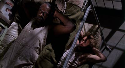 Still from Raising Arizona (1987) that has been tagged with: prison & interior & night