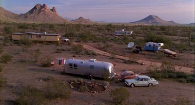 Still from Raising Arizona (1987) that has been tagged with: day & mobile home