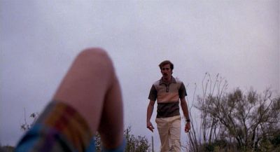 Still from Raising Arizona (1987) that has been tagged with: 0f0f0f & over-the-shoulder & wide shot