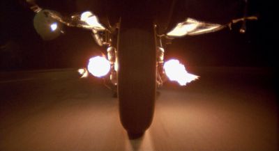 Still from Raising Arizona (1987) that has been tagged with: motorcycle & night & exterior