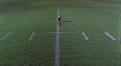 Still from Raising Arizona (1987) that has been tagged with: exterior & football field & wide shot