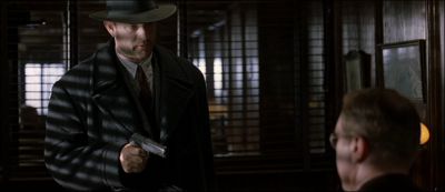 Still from Road To Perdition (2002) that has been tagged with: gun & interior & medium shot & blinds & over-the-shoulder