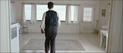 Still from Road To Perdition (2002) that has been tagged with: bfbfbf & kitchen & over-the-shoulder & wide shot & interior