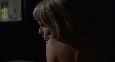 Still from Rosemary's Baby (1968) that has been tagged with: 4f404c & over-the-shoulder & medium close-up & night & clean single