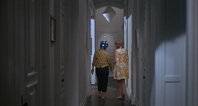 Still from Rosemary's Baby (1968) that has been tagged with: two-shot & wide shot & hallway
