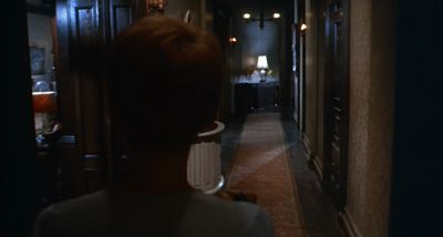 Still from Rosemary's Baby (1968) that has been tagged with: over-the-shoulder & hallway