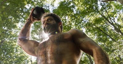 Still from RRR (2022) that has been tagged with: woods & medium shot & day & low-angle