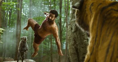 Still from RRR (2022) that has been tagged with: 908051 & tiger & wolf & jumping