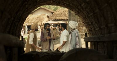 Still from RRR (2022) that has been tagged with: frame in a frame & tunnel