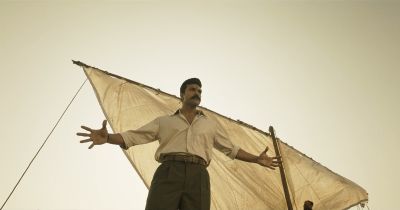 Still from RRR (2022) that has been tagged with: low-angle & wide shot