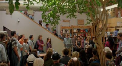 Still from Ruby Sparks (2012) that has been tagged with: day & bookstore & group-shot & interior