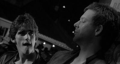 Still from Rumble Fish (1983) that has been tagged with: fffafa & black and white & medium close-up & night