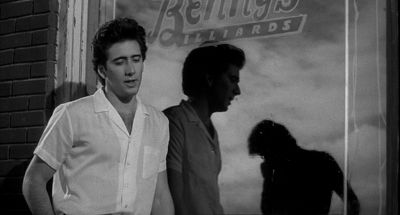 Still from Rumble Fish (1983) that has been tagged with: over-the-shoulder & reflection
