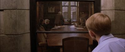 Still from Rushmore (1998) that has been tagged with: medium shot & conference room & interior & board room & over-the-shoulder