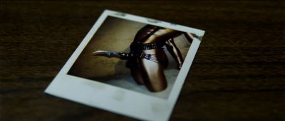 Still from Se7en (1995) that has been tagged with: insert & polaroid