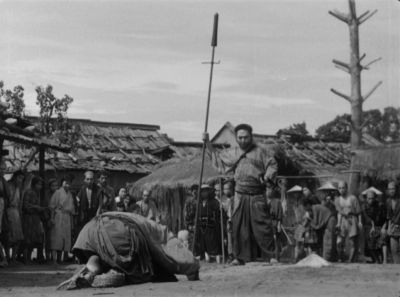 Still from Seven Samurai (1954) that has been tagged with: group-shot & wide shot & black and white & exterior & over-the-shoulder & day