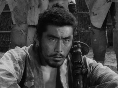 Still from Seven Samurai (1954) that has been tagged with: black and white & sword & exterior & medium close-up & clean single