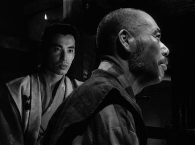 Still from Seven Samurai (1954) that has been tagged with: profile shot & night & black and white & two-shot & medium shot