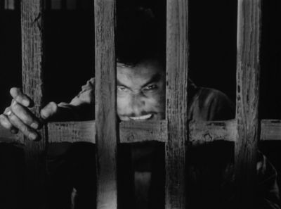 Still from Seven Samurai (1954) that has been tagged with: prison & black and white & night