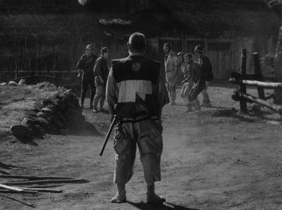 Still from Seven Samurai (1954) that has been tagged with: group-shot & wide shot & black and white & night