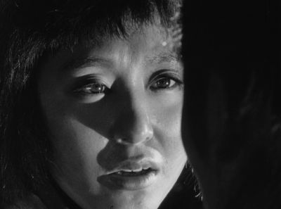Still from Seven Samurai (1954) that has been tagged with: black and white & interior & over-the-shoulder & night & close-up