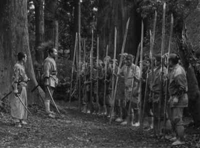 Still from Seven Samurai (1954) that has been tagged with: wide shot & exterior & black and white & woods & group-shot