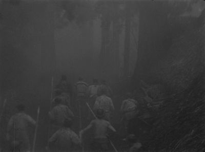 Still from Seven Samurai (1954) that has been tagged with: 0f0f0f & over-the-shoulder & wide shot & exterior & day