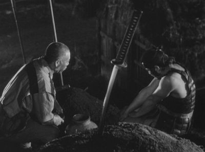 Still from Seven Samurai (1954) that has been tagged with: medium wide & night & over-the-shoulder