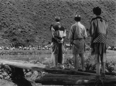 Still from Seven Samurai (1954) that has been tagged with: bfbfbf & black and white & exterior & day & over-the-shoulder