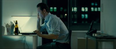 Still from Shame (2011) that has been tagged with: night & medium shot & desk & clean single