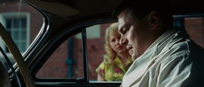 Still from Shutter Island (2010) that has been tagged with: 000000 & over-the-shoulder & medium close-up & car interior