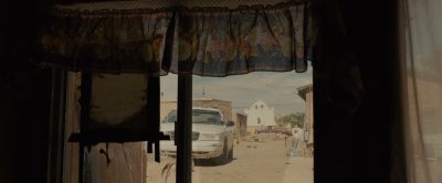 Still from Sicario (2015) that has been tagged with: 000000 & window & police car