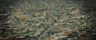 Still from Sicario (2015) that has been tagged with: 714f38 & establishing shot & high-angle & mexico