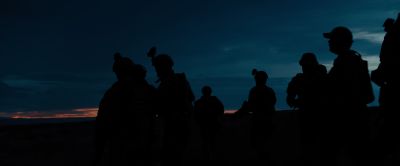 Still from Sicario (2015) that has been tagged with: profile shot & group-shot & wide shot & silhouette & sunset