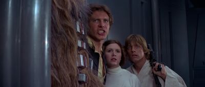 Still from Star Wars: A New Hope (1977) that has been tagged with: medium shot & group-shot & interior