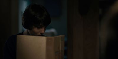 Still from TV Show: Netflix — "Stranger Things: Season 1 - Episode 1" that has been tagged with: 3d341f & reading