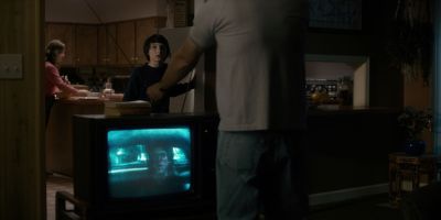 Still from TV Show: Netflix — "Stranger Things: Season 1 - Episode 1" that has been tagged with: tv & watching tv & kitchen