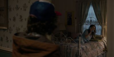 Still from TV Show: Netflix — "Stranger Things: Season 1 - Episode 1" that has been tagged with: two-shot & bed & over-the-shoulder & night & phone & interior