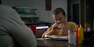 Still from TV Show: Netflix — "Stranger Things: Season 1 - Episode 1" that has been tagged with: restaurant & table & eating & interior